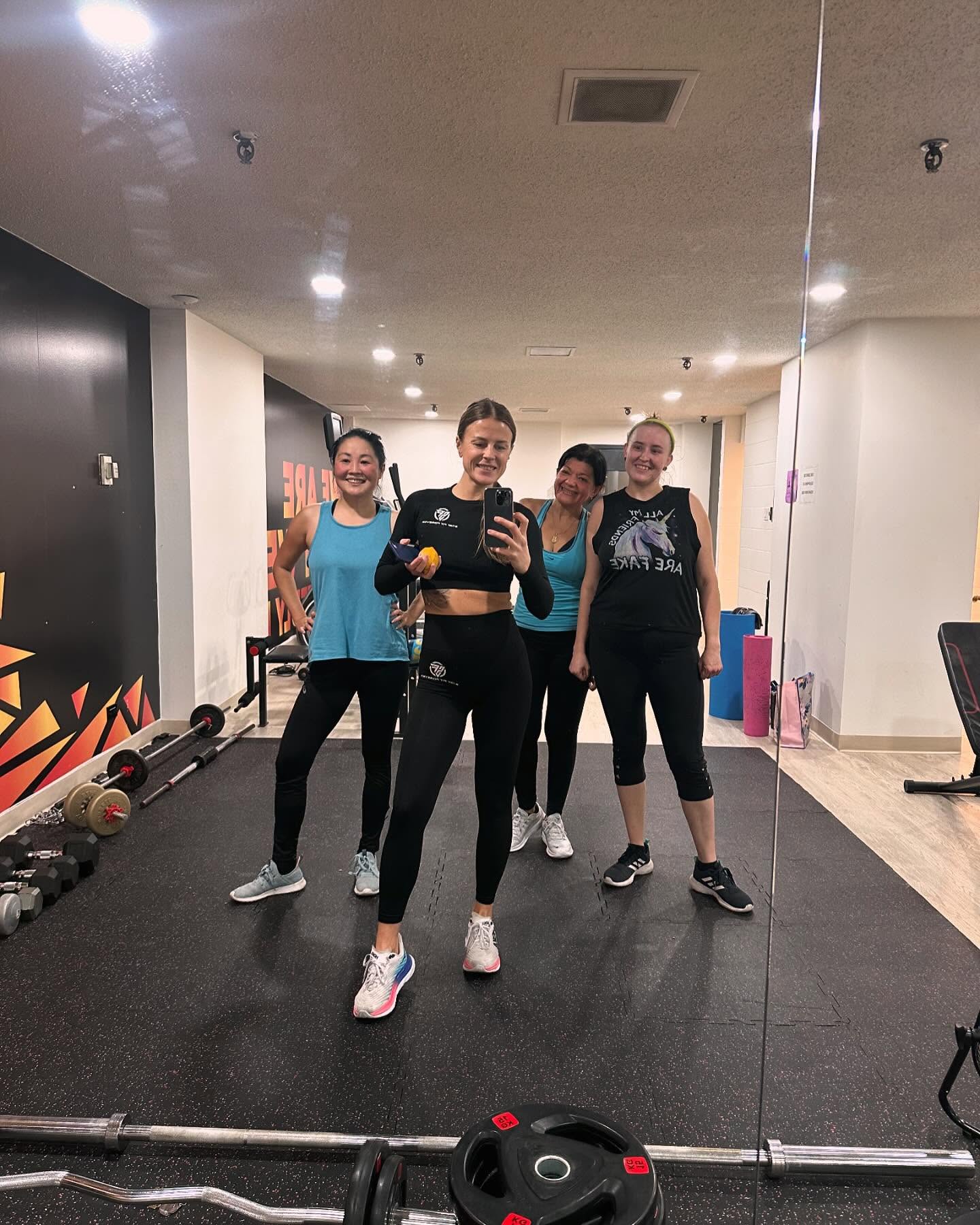 Inna training with three clients in a gym