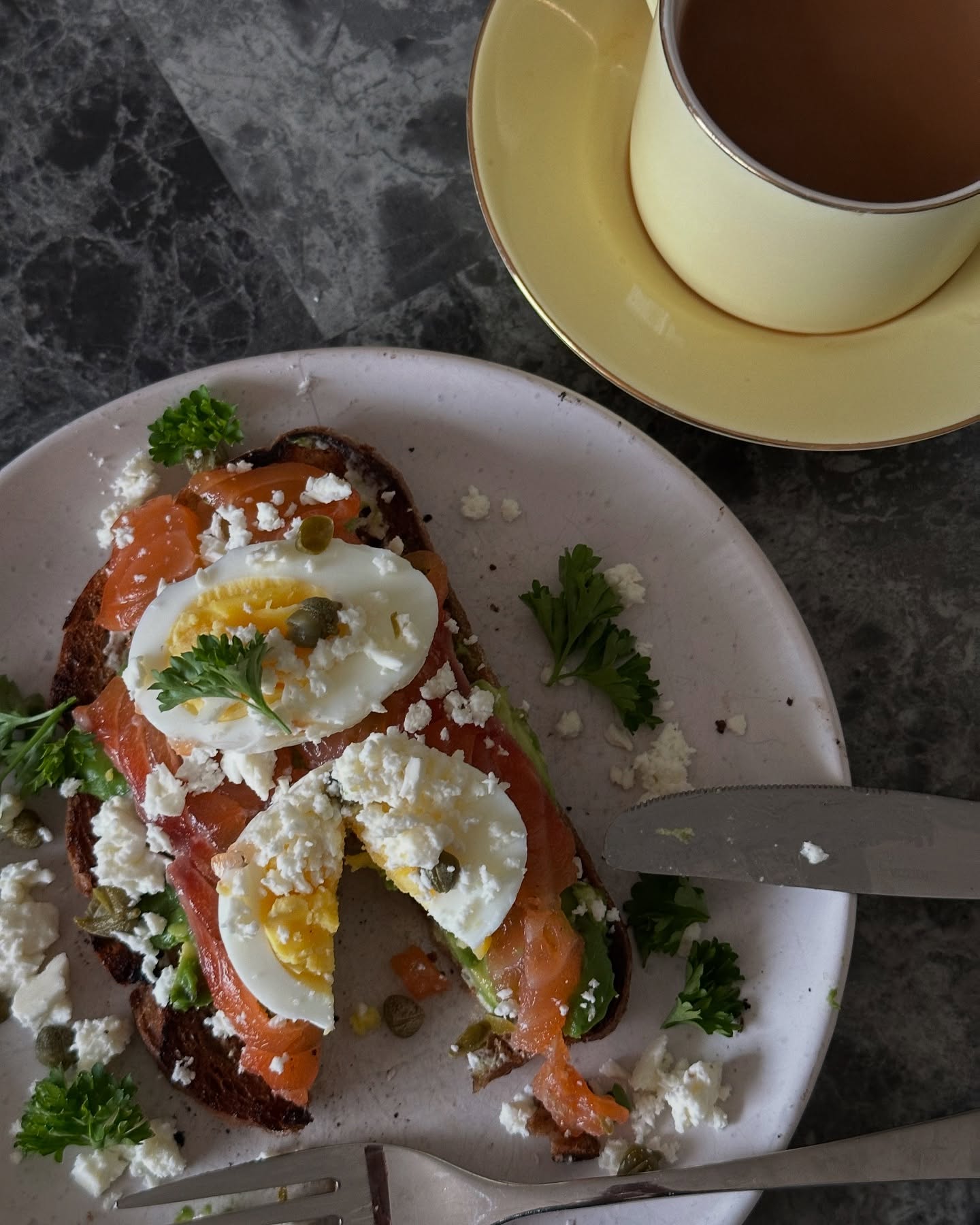 Salmon, egg, avocado, and toast meal